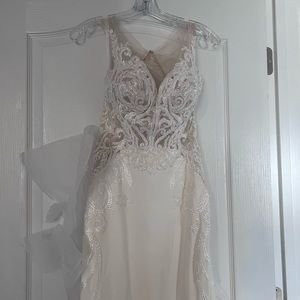Brand new designer wedding dress, never altered, size 10